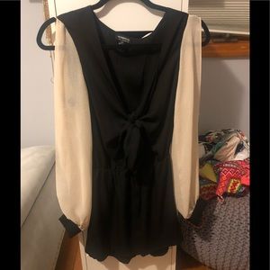 Black front tie romper with nude sheer sleeves